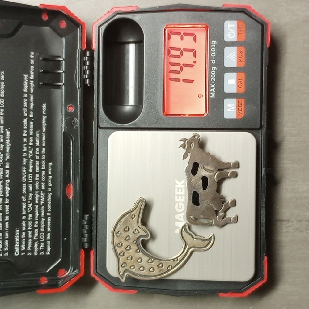 2 .925 silver pins 1 dolphin 1 cow 14.93 grams